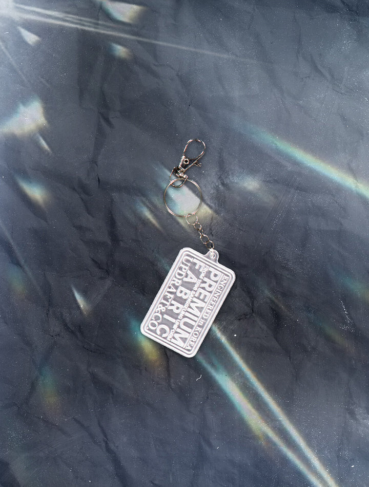 LOGO PATCH ACRYLIC PENDENT ACC MIXED -WHITE